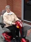 customer in powered wheelchair out and about in Manchester